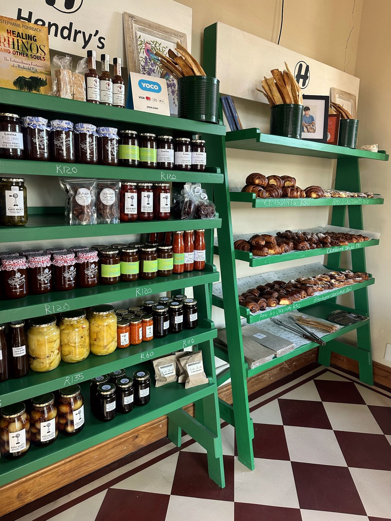 Jams and preserves on green shelves
